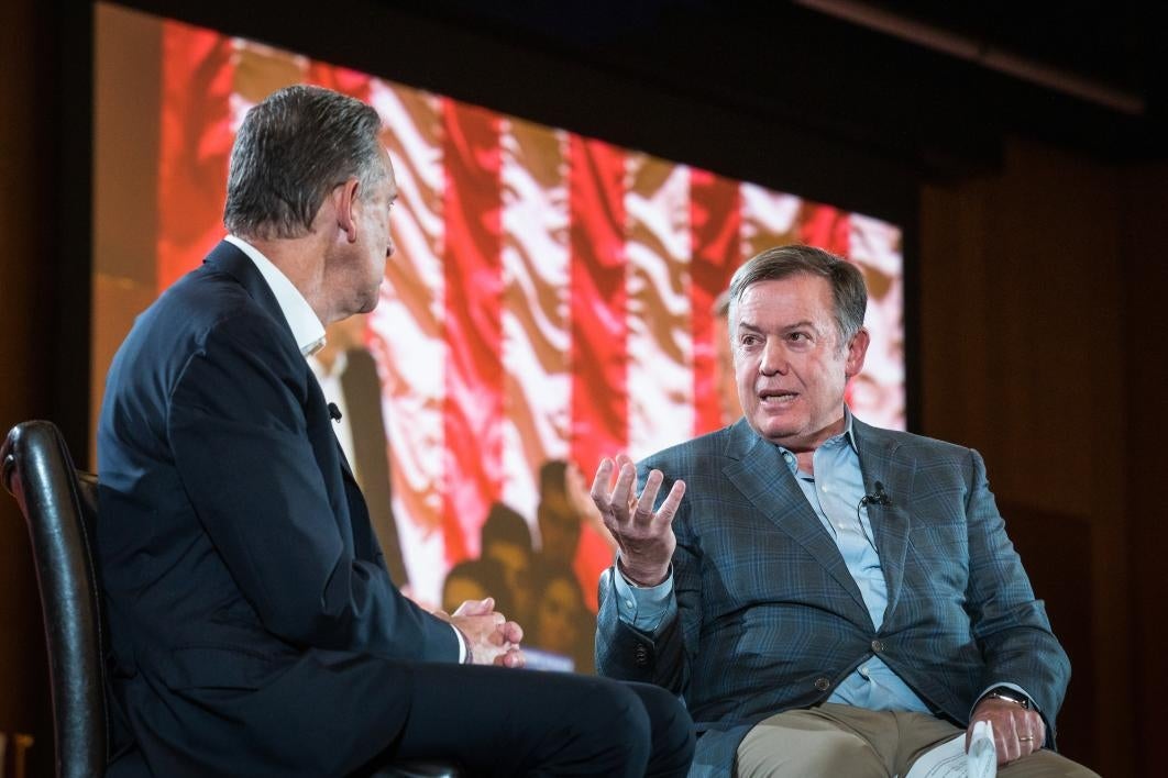 Howard Schultz of Starbucks speaks with ASU President Michael Crow onstage