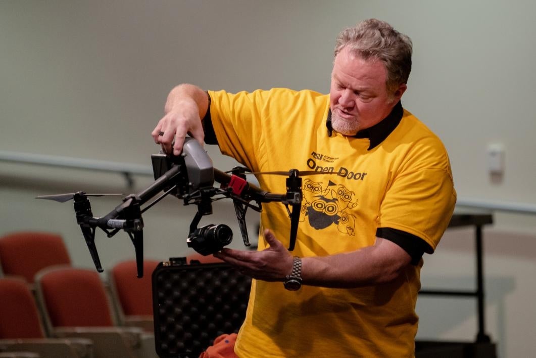 man holds a drone