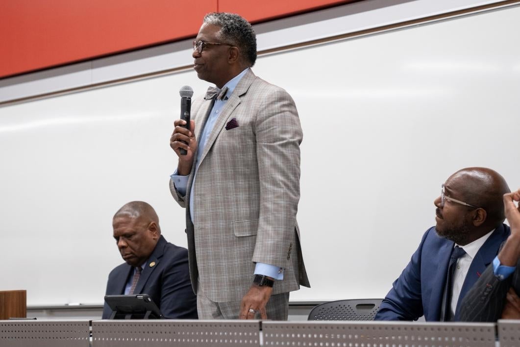 A man speaks on a panel