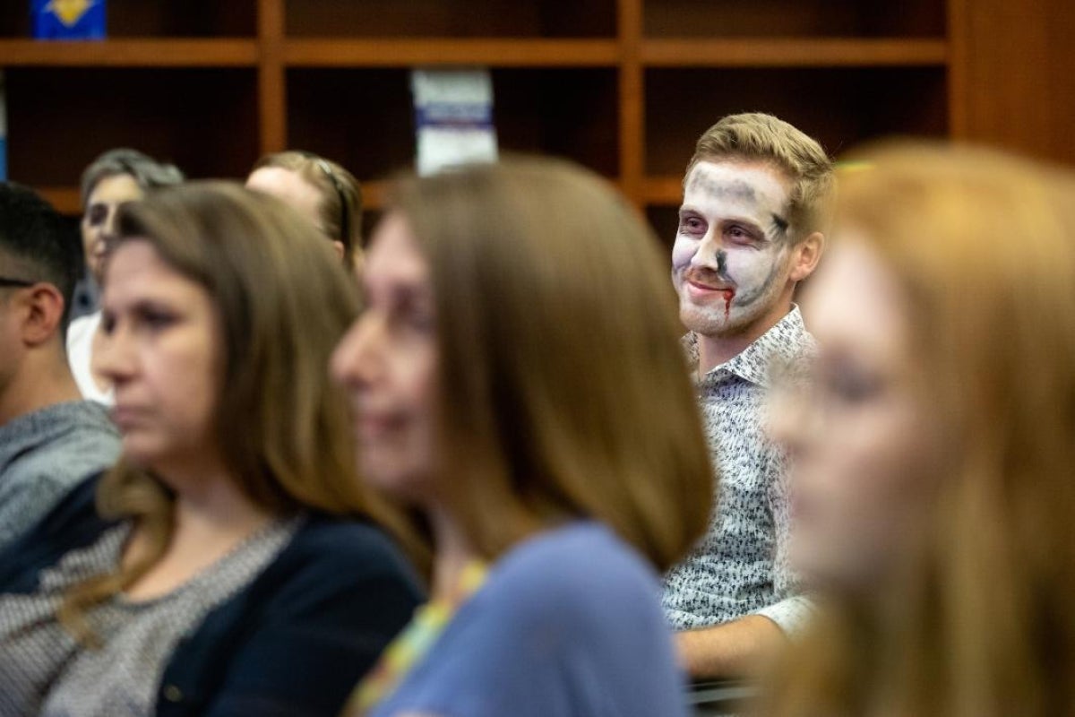 man in zombie makeup in audience