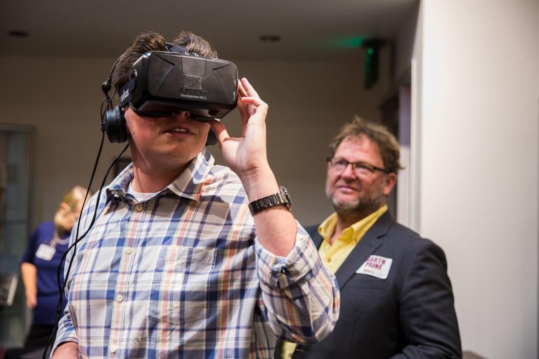 A student tries out the virtual-reality headset of EcoRift