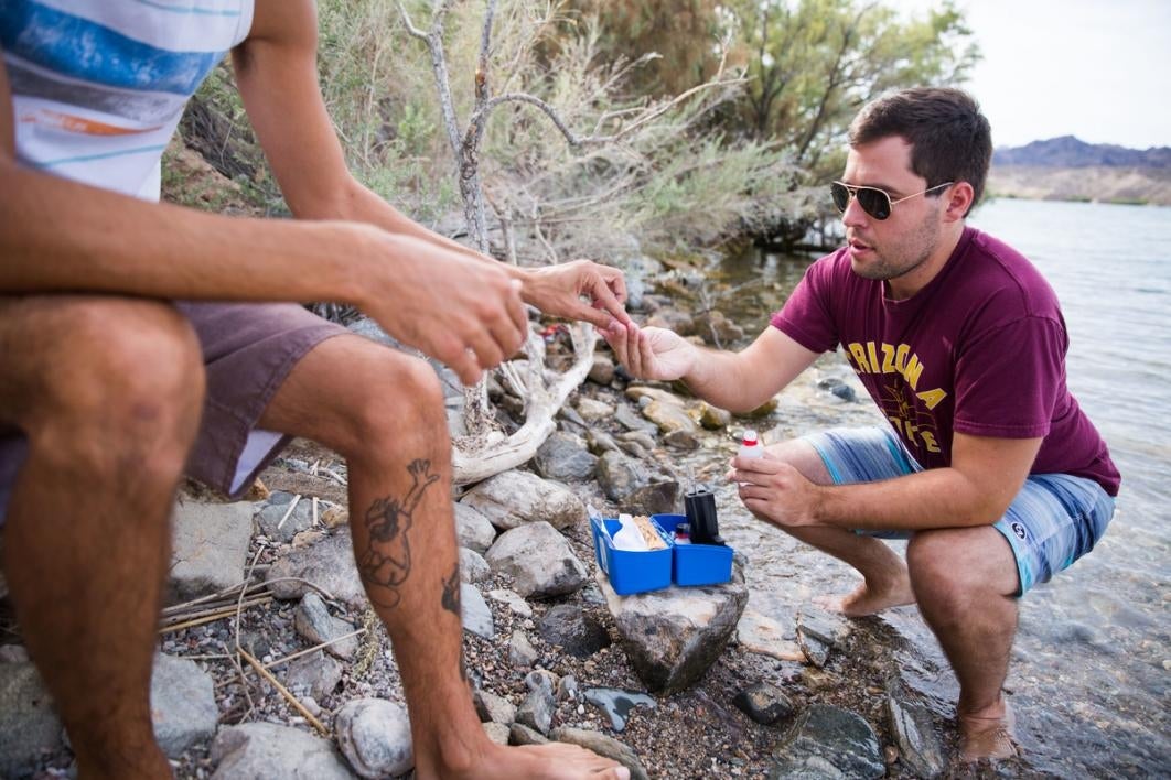 People testing water.