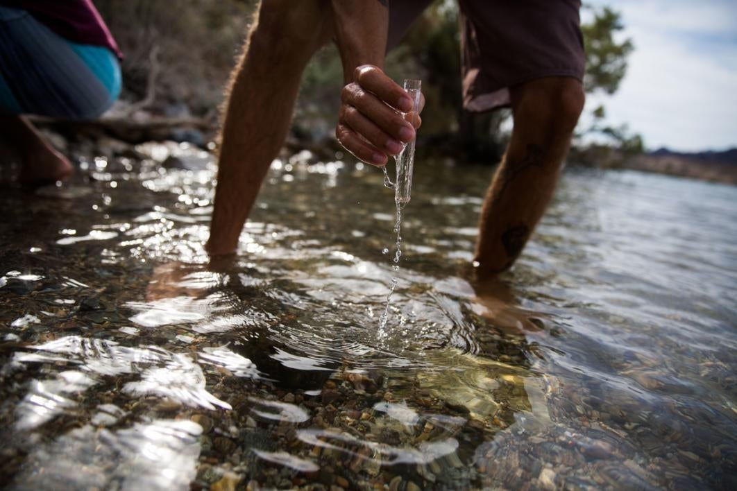 Taking a water sample.