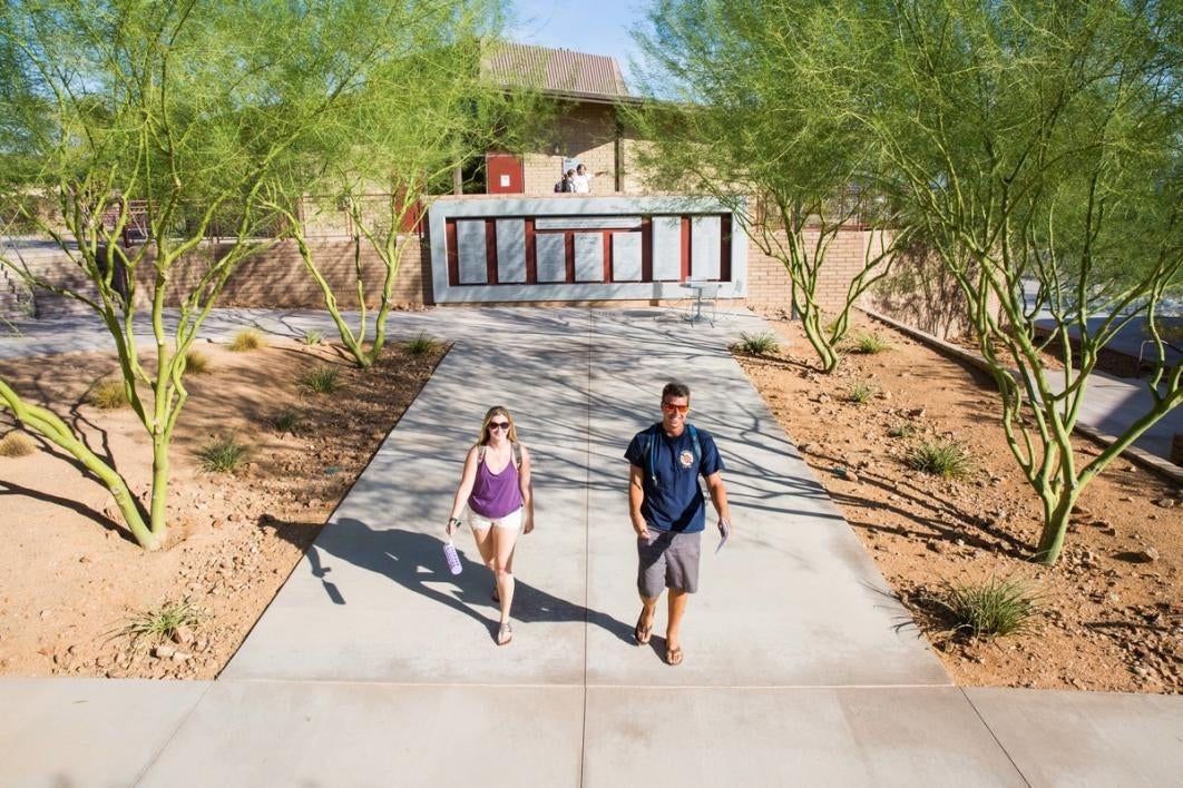 People walking on a sidewalk.