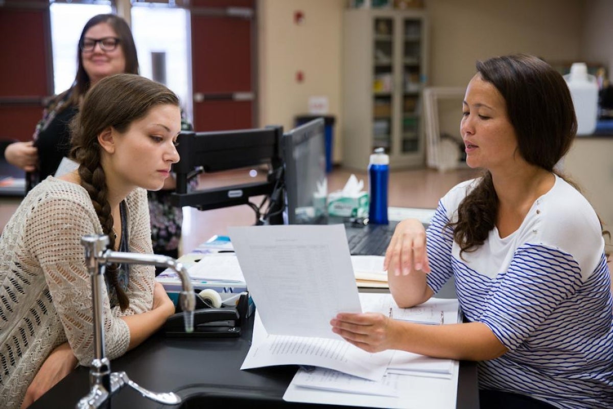 Three women in a classroom