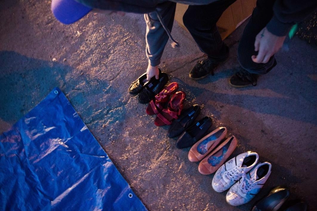 man organizing shoes