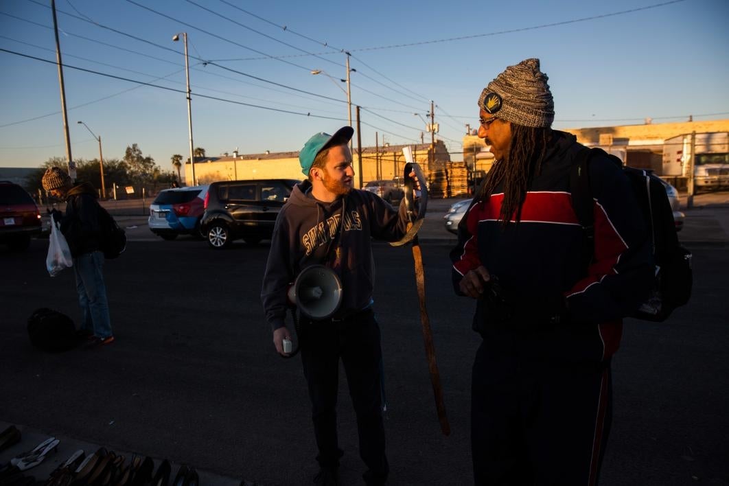 two men speaking at day of service