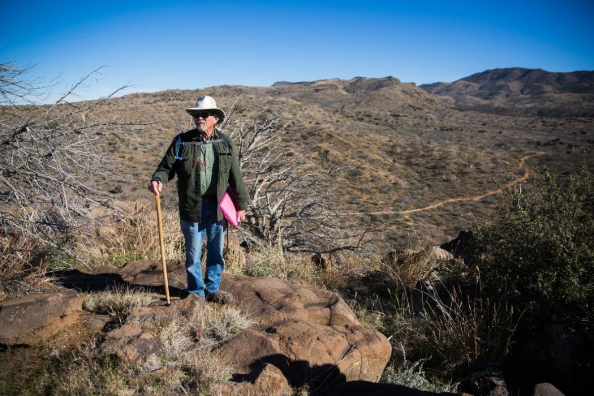 man standing in desert area