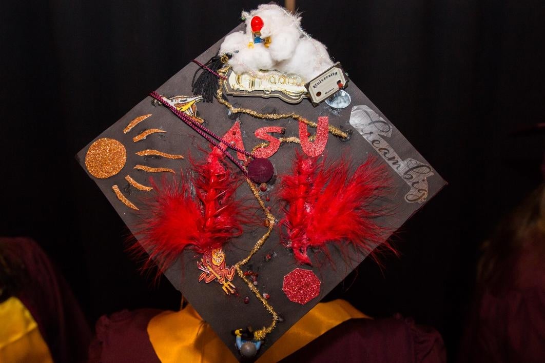 A graduation cap reads, 