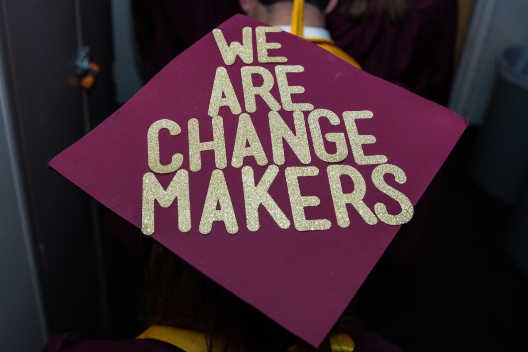 Words on a graduate's mortar board.