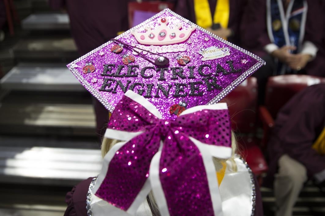 A graduation cap reads, 