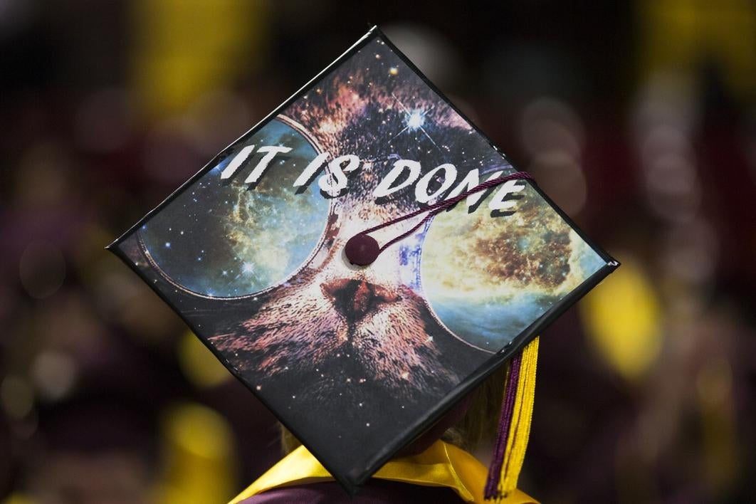 A graduation cap reads, 