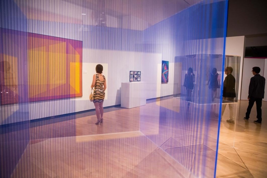 Woman looking at art in a museum.