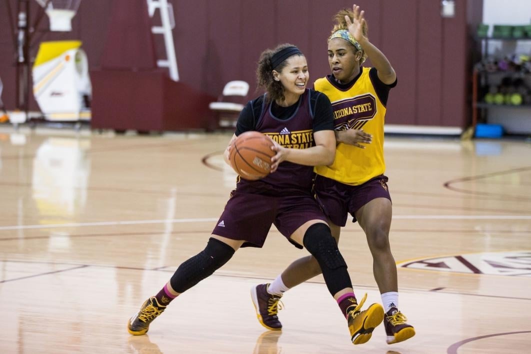 Basketball players practicing.