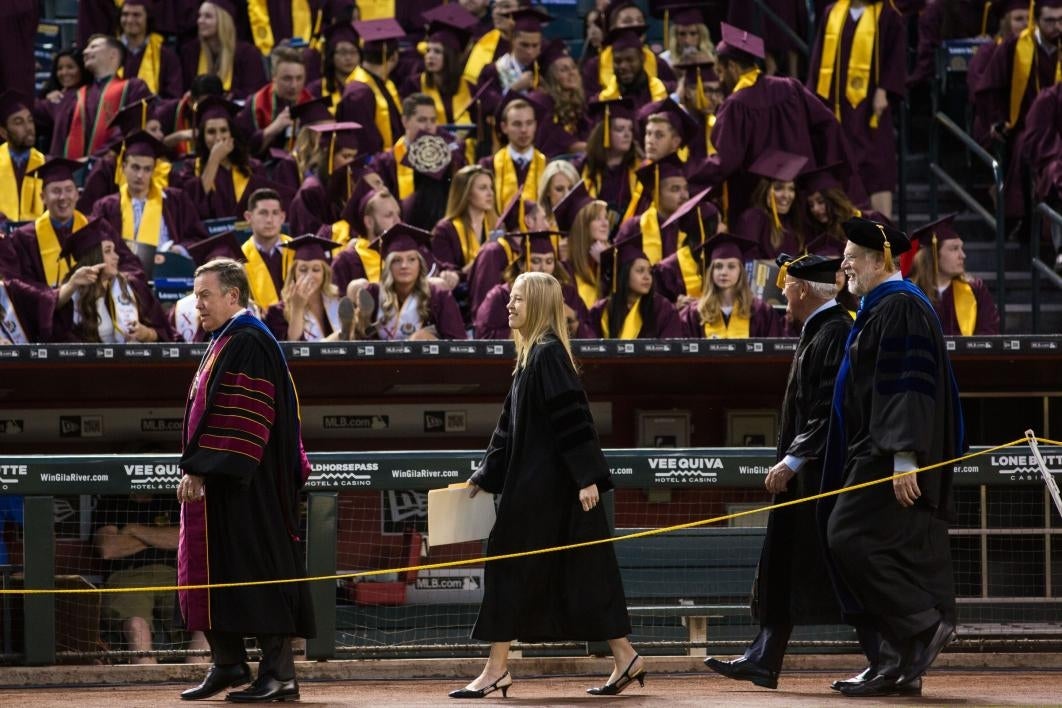 people walking into commencement