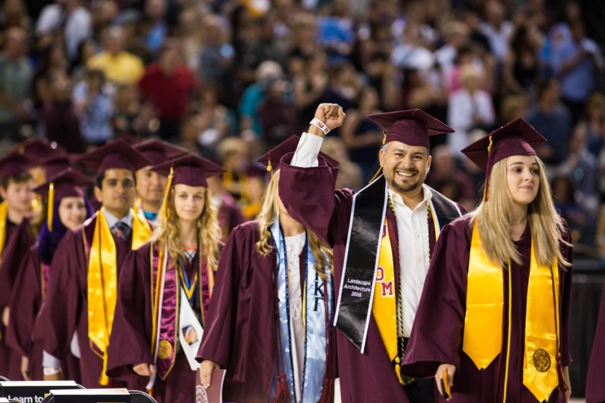 students walking into commencement