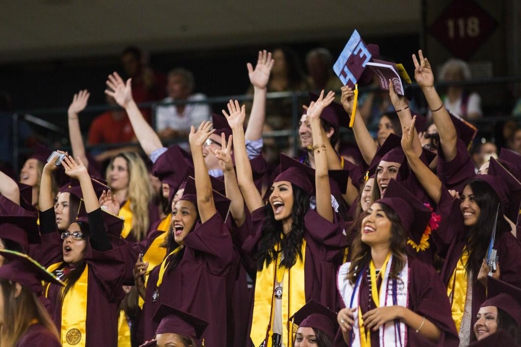 students celebrating graduation