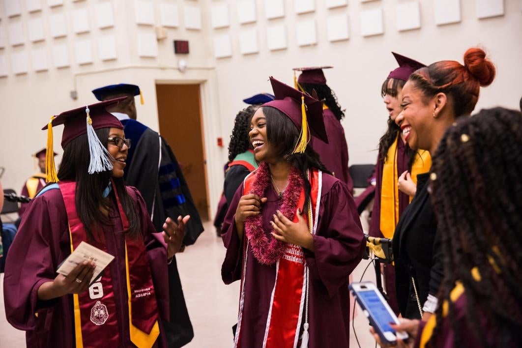 graduates laughing