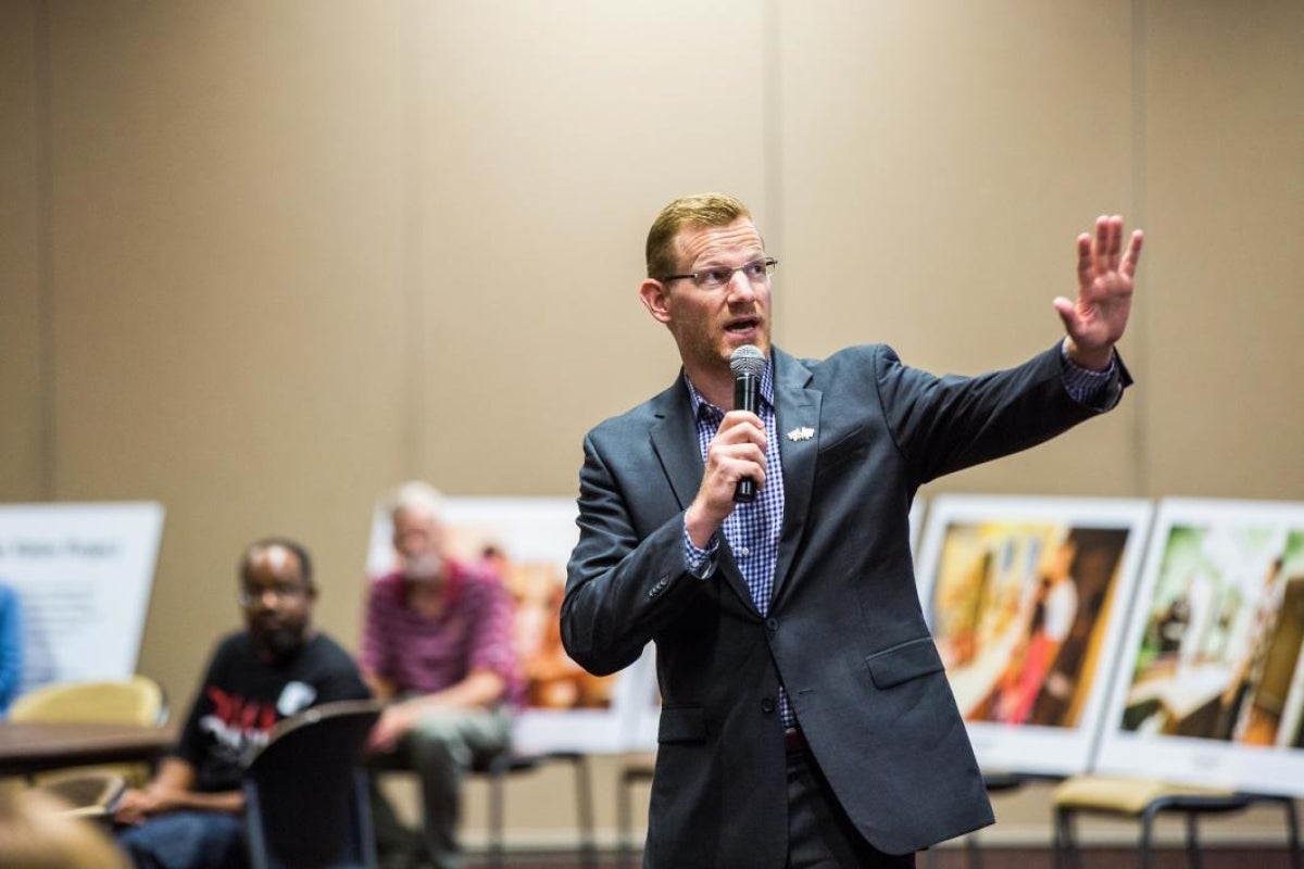 man speaking to audience