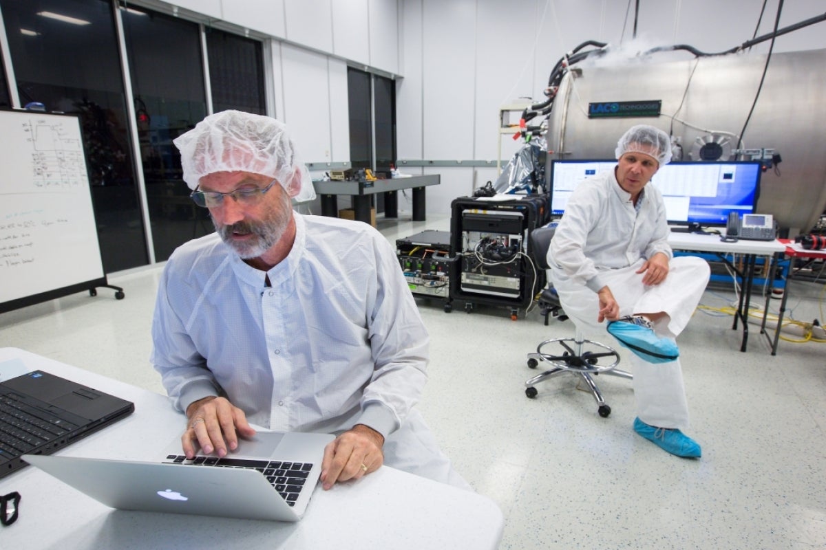 two men working in clean lab