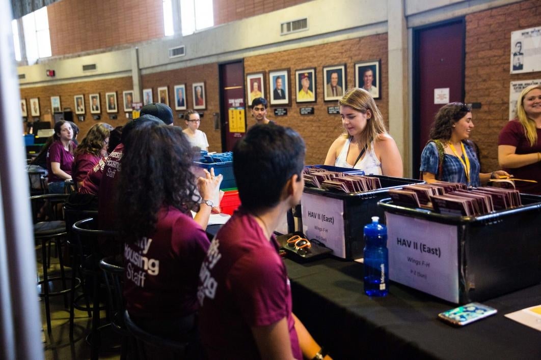 student in line to get housing papers at Wells Fargo Arena