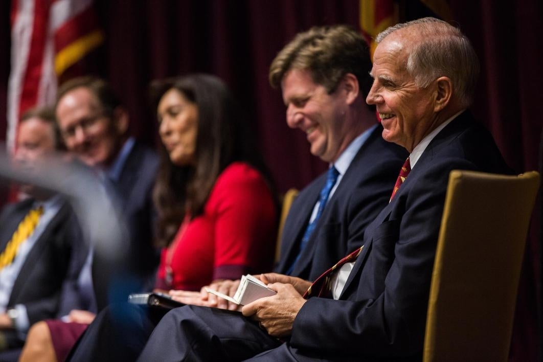 Leo Beus laughs at remarks during the law center opening.