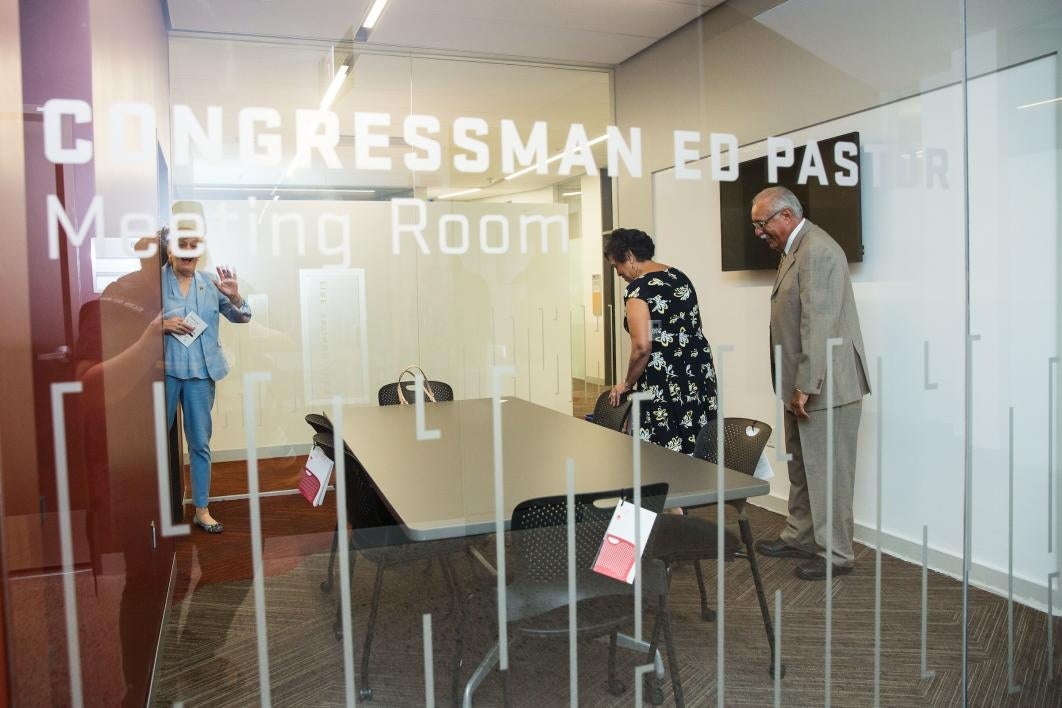 Retired U.S. Rep. Ed Pastor tours the Ed Pastor Meeting Room at the new law center.