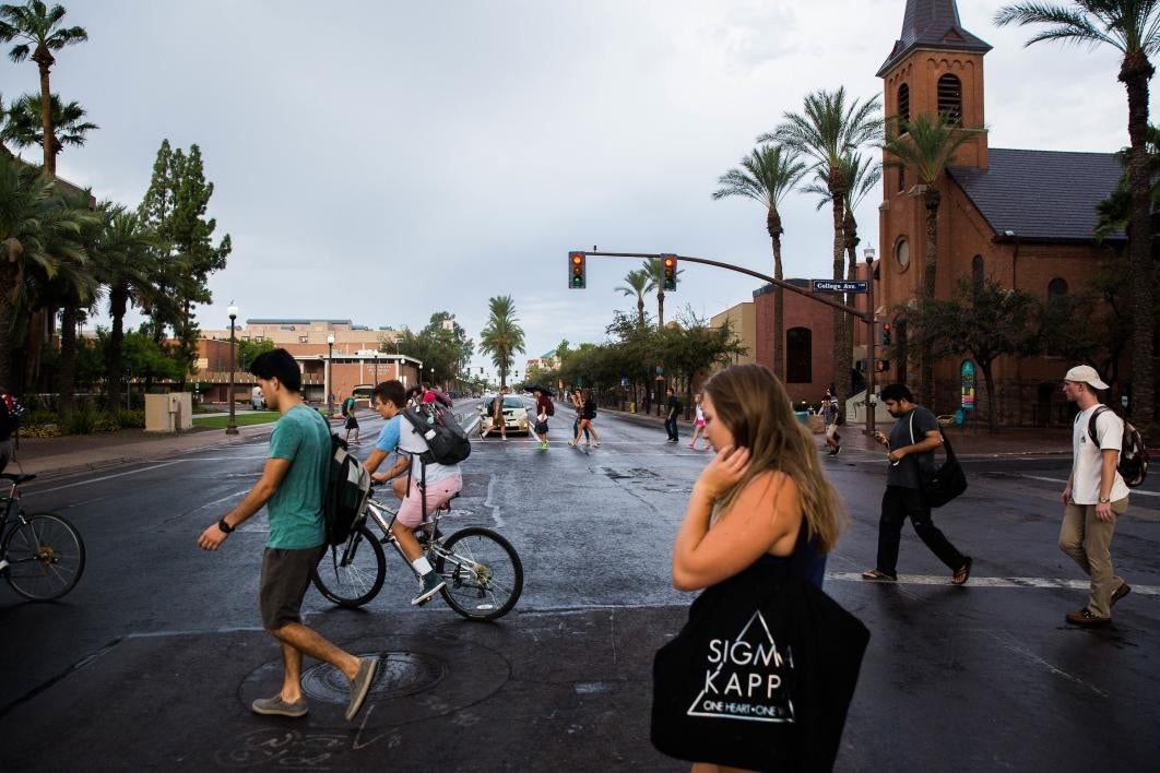 students crossing street on campus