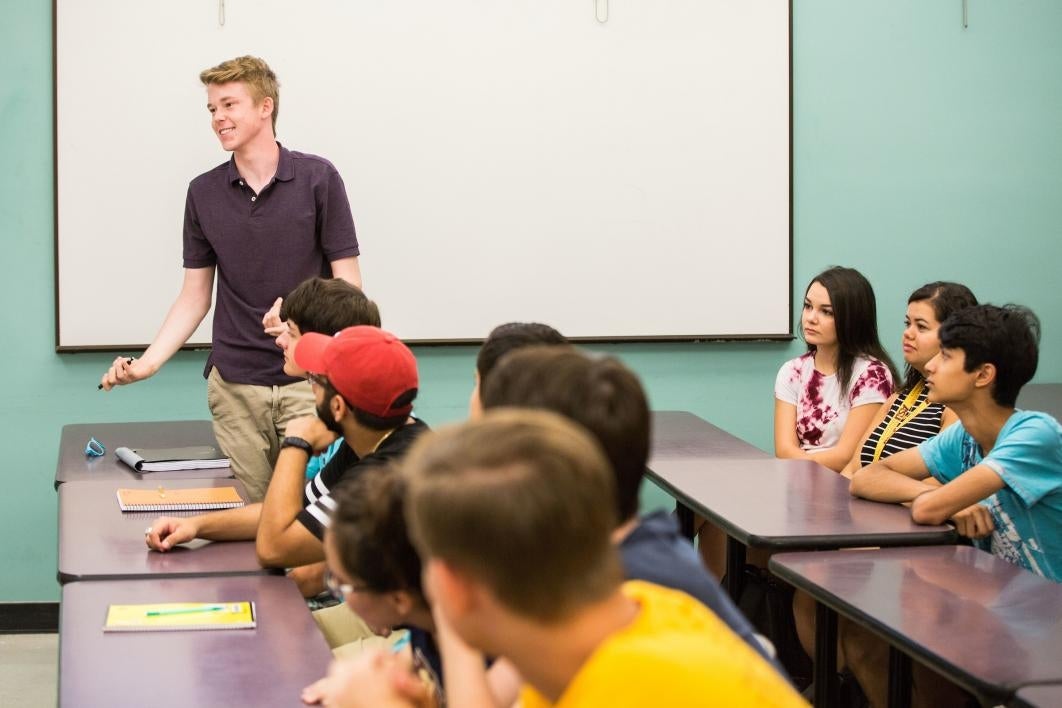 student standing up in class introducing himself