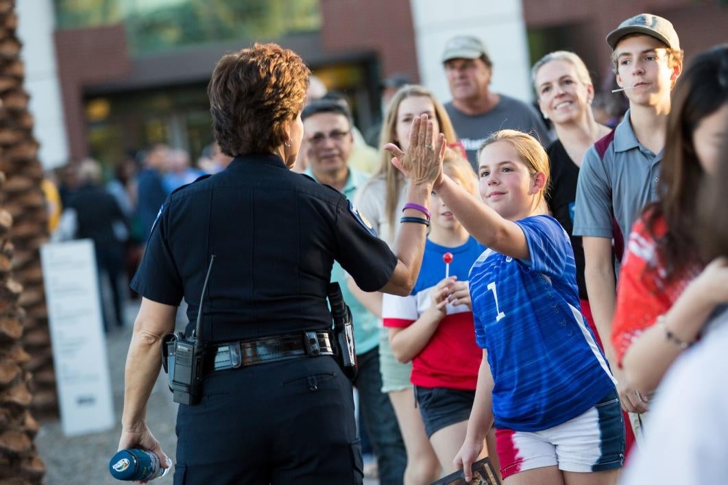 two people high-fiving