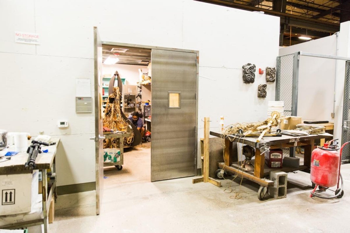 A sculpture artist works in Grant Street Studios