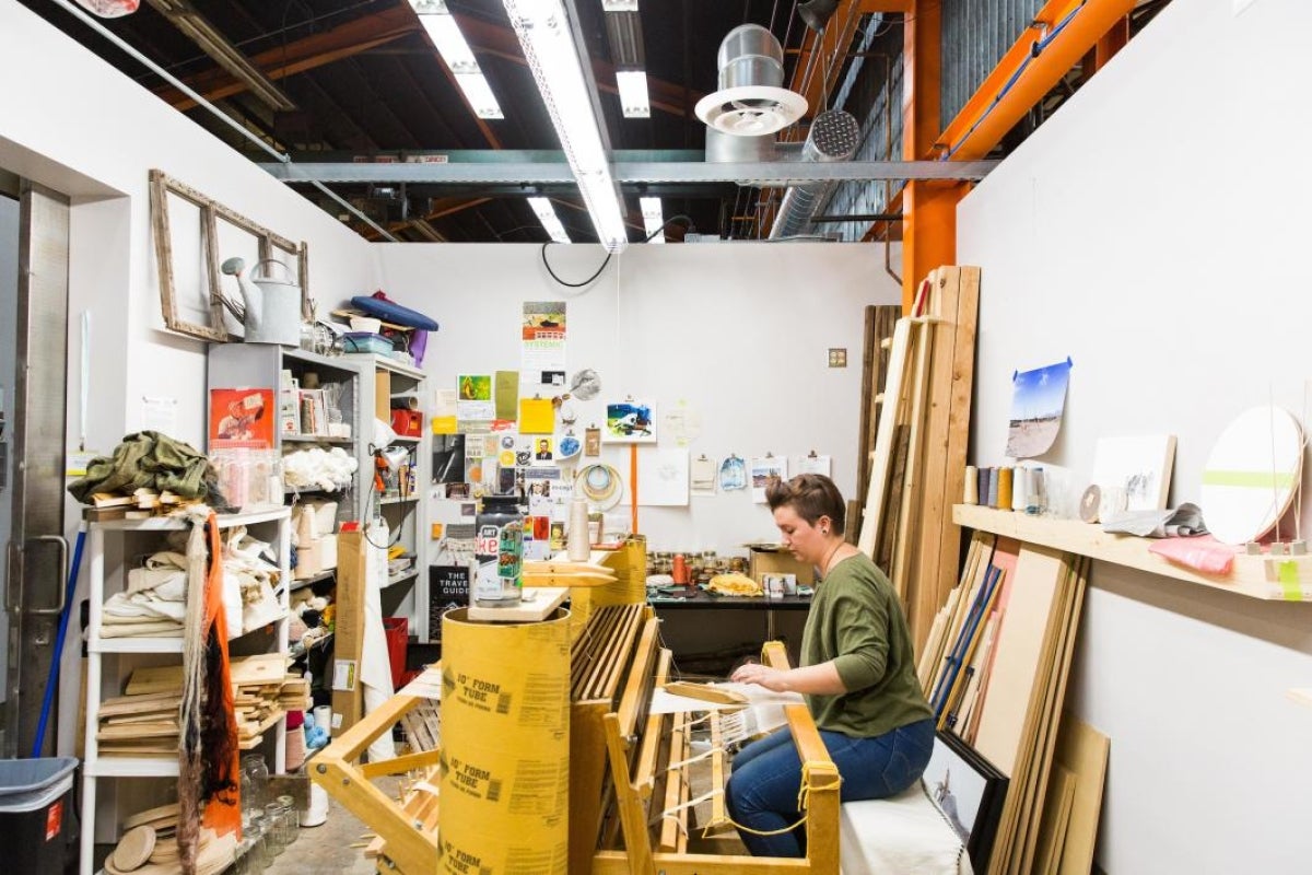  Fibers artist Molly Koehn works on her loom