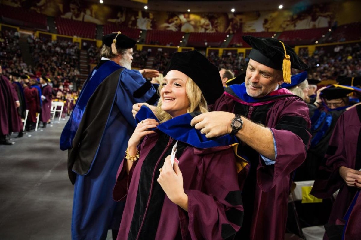 doctoral student being hooded