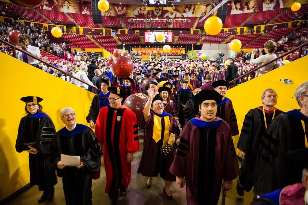 student waving to family