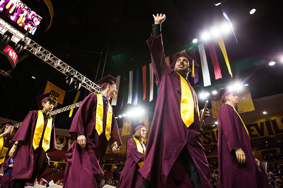 Grads leave the hall