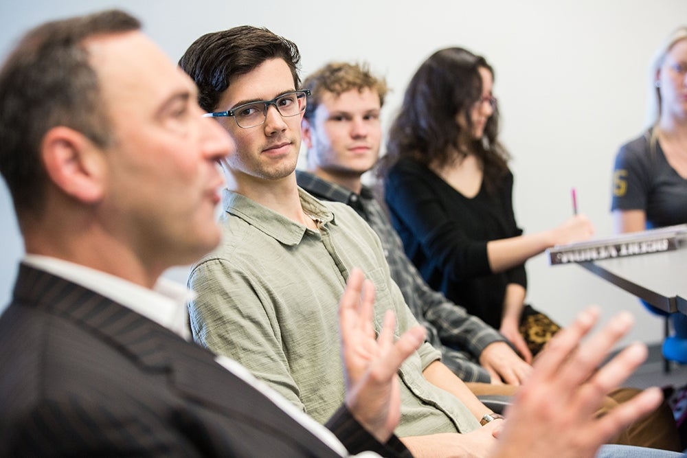 Students listen to Rothenberg