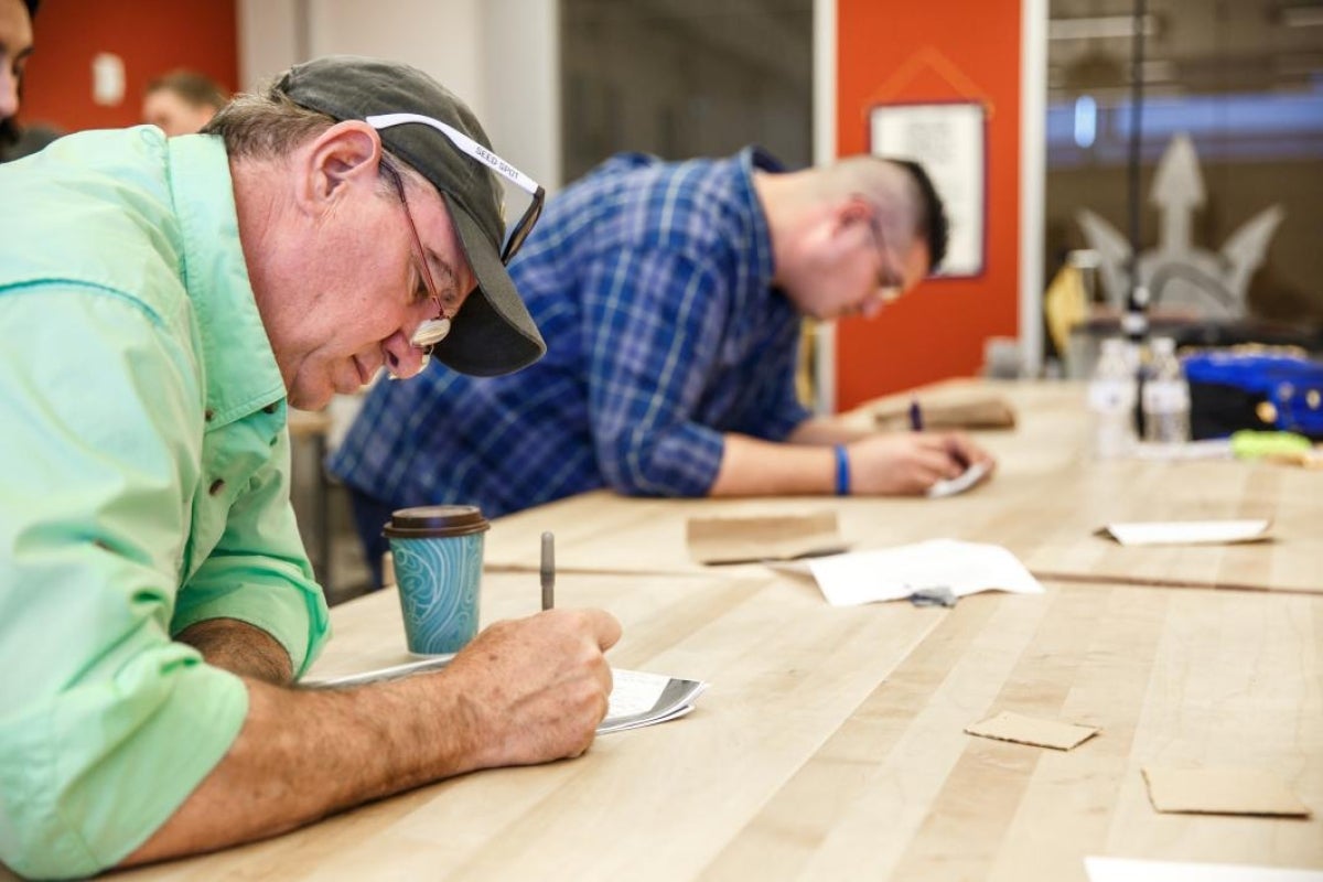 Judges tally their scores at the hackathon