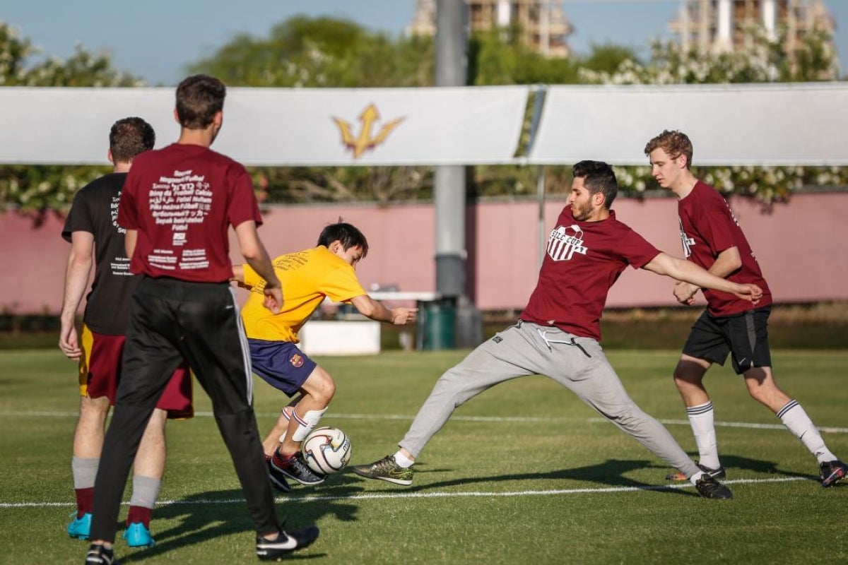 students playing soccer