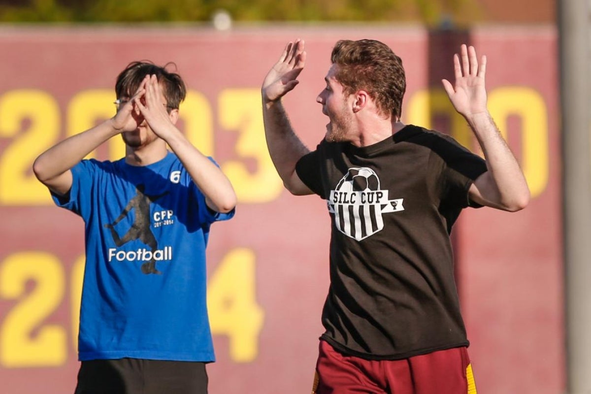 students playing soccer