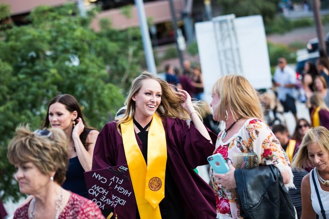 student walking to graduation