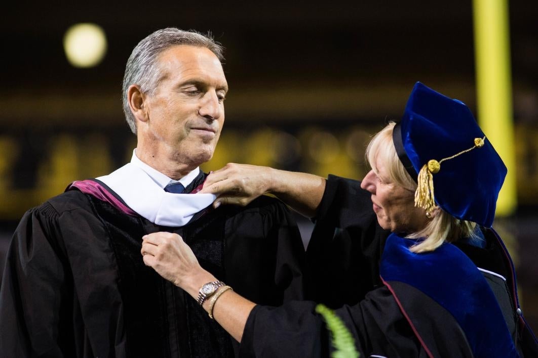 man being given graduation award