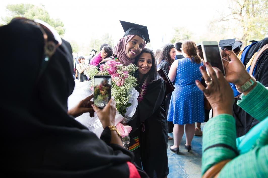 Friends hug at the Thunderbird School of Global Management commencement