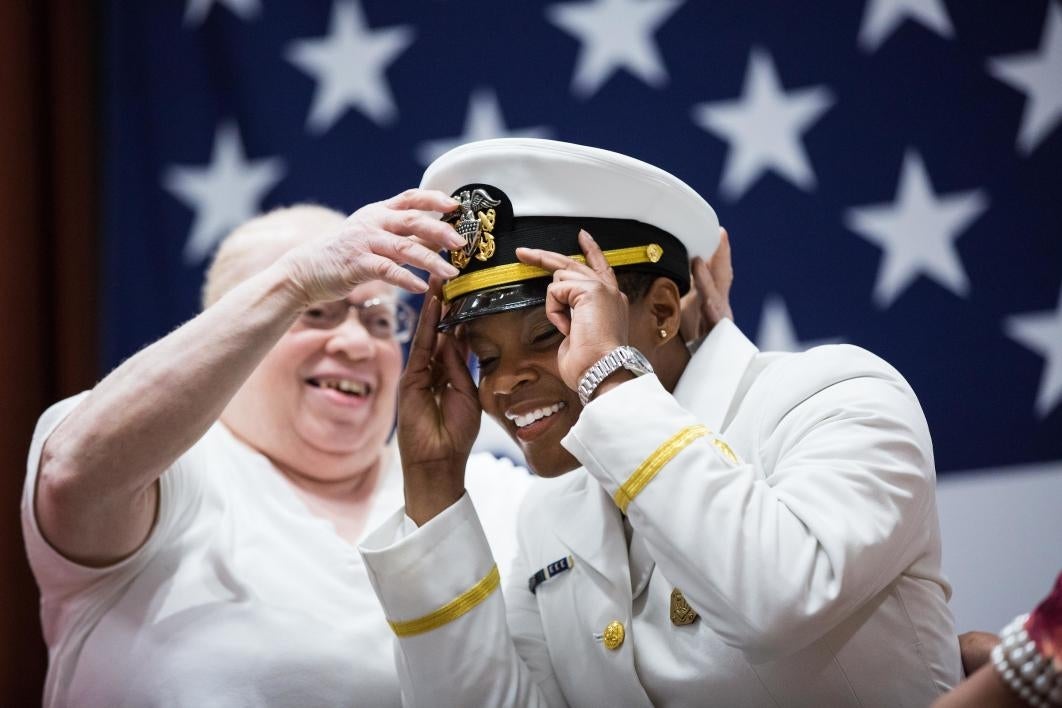 mother helping cadet with new uniform