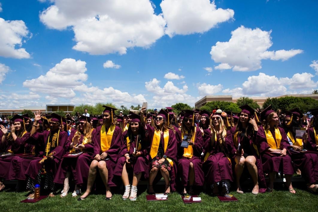 crowd of graduates sitting at convocation