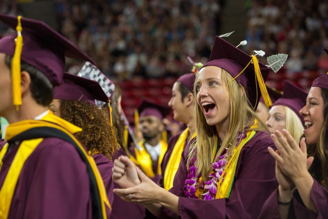 graduate clapping at convocation