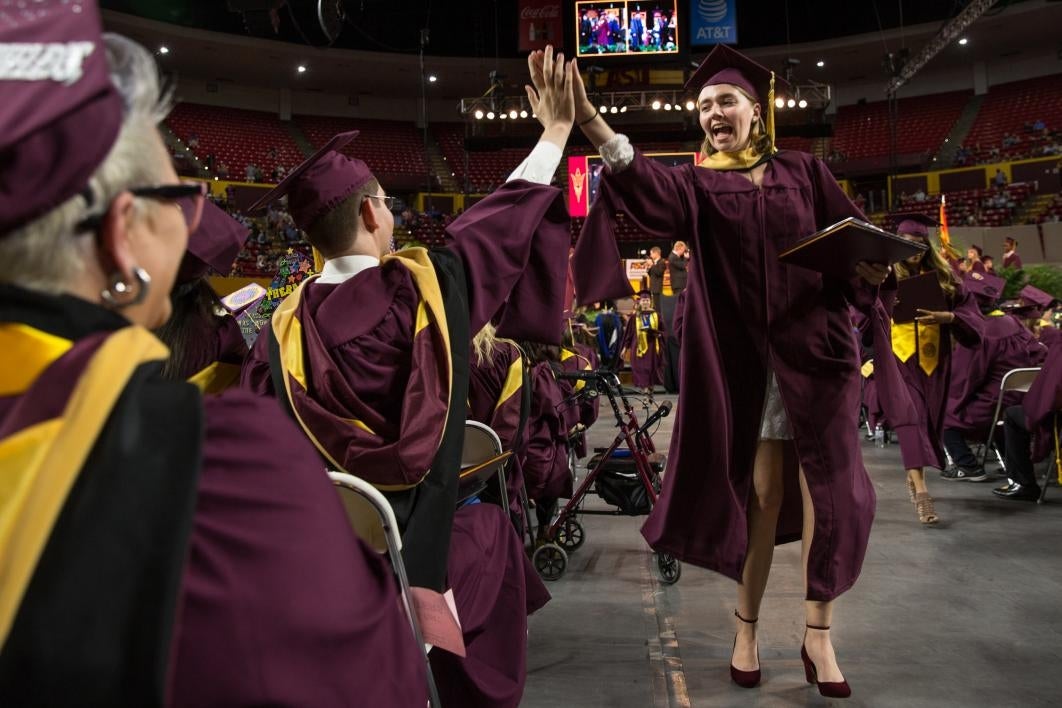 graduate high-fiving friend