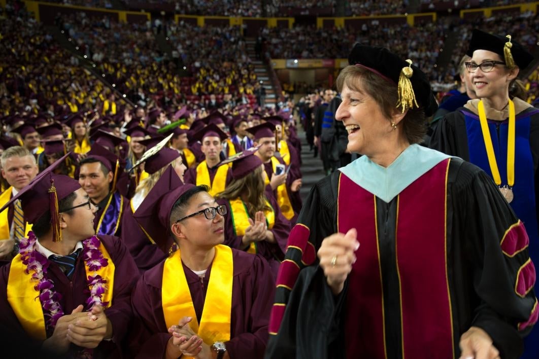 dean walking down aisle at convocation