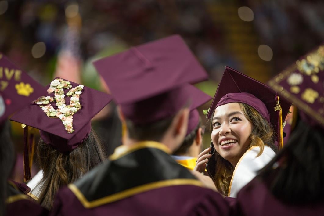 graduate calling parents on phone