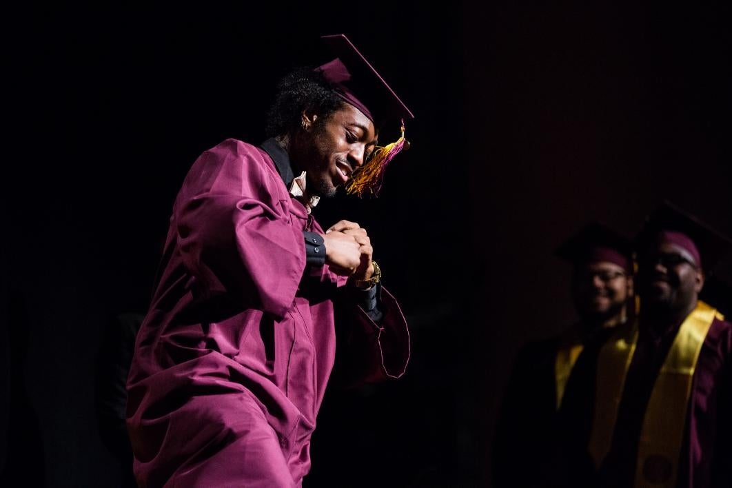 graduate dancing on stage