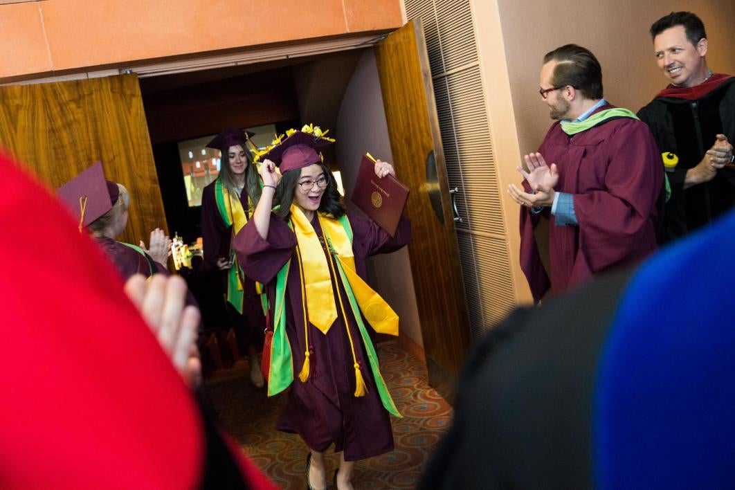 graduate dancing while leaving convocation